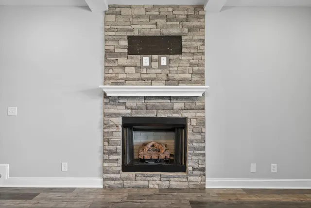 a fireplace with a hallway