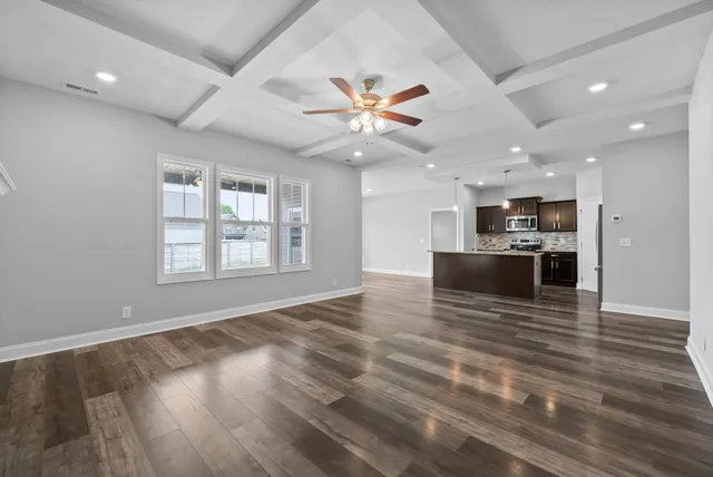 a view of kitchen with sink microwave and stove