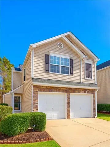 a front view of a house with a garage