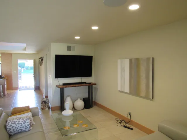 a living room with furniture a window and a fireplace