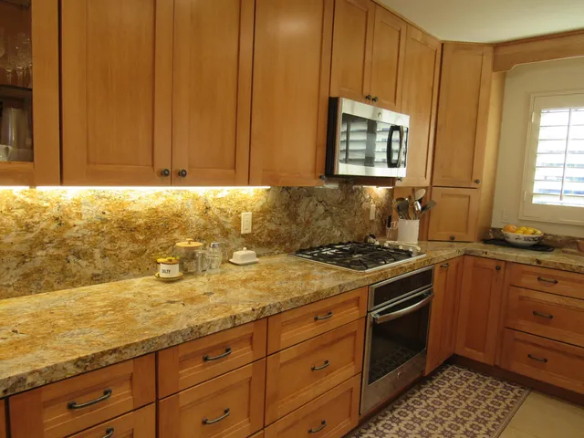 a living room with furniture a dining table and a fireplace