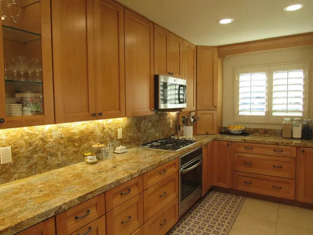 a room with a fireplace and potted plant