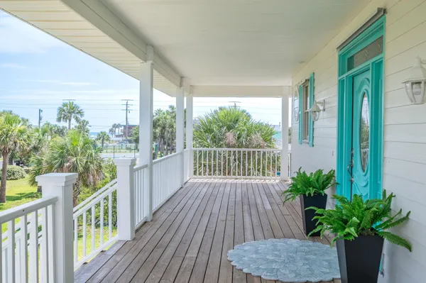 a view of a balcony with lake view and wooden floor