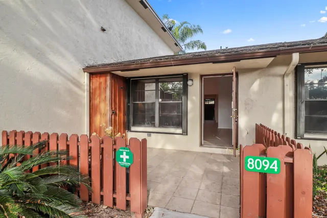 a front view of a house with parking