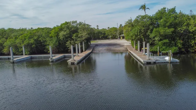 a view of house with outdoor space and lake view