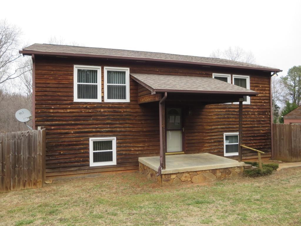 1914 Navigation Point Goodview, VA 24095 - Photo 1 of 15 a front view of a house with garage