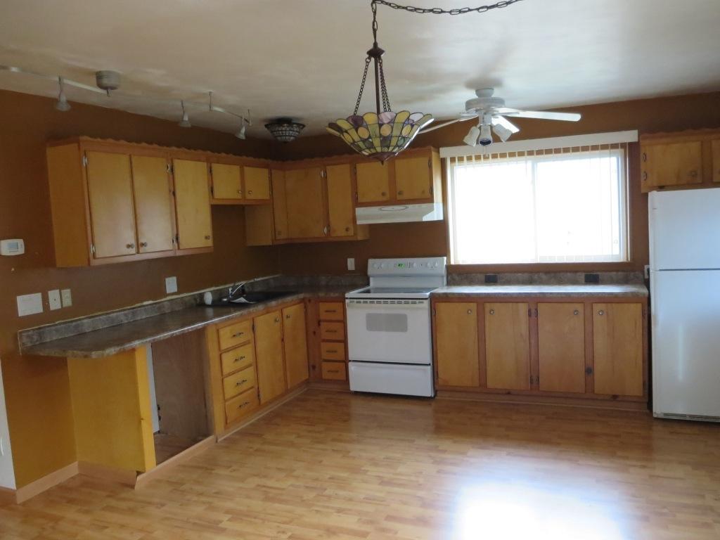 1914 Navigation Point Goodview, VA 24095 - Photo 2 of 15 a kitchen with granite countertop a sink cabinets and window