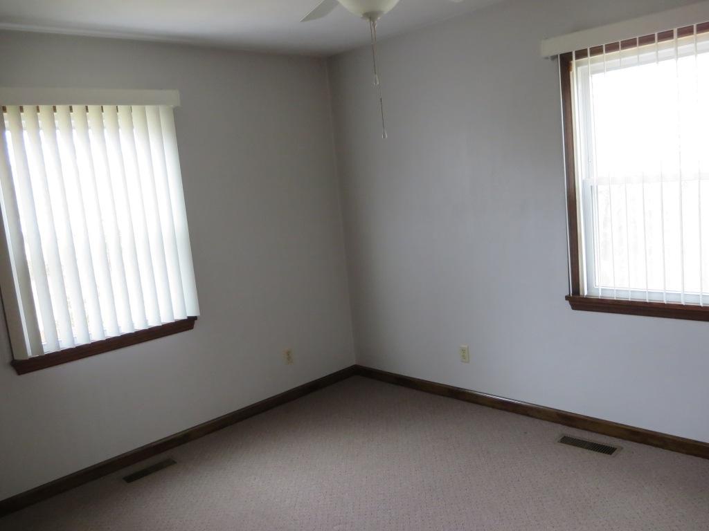 1914 Navigation Point Goodview, VA 24095 - Photo 9 of 15 an empty room with a window