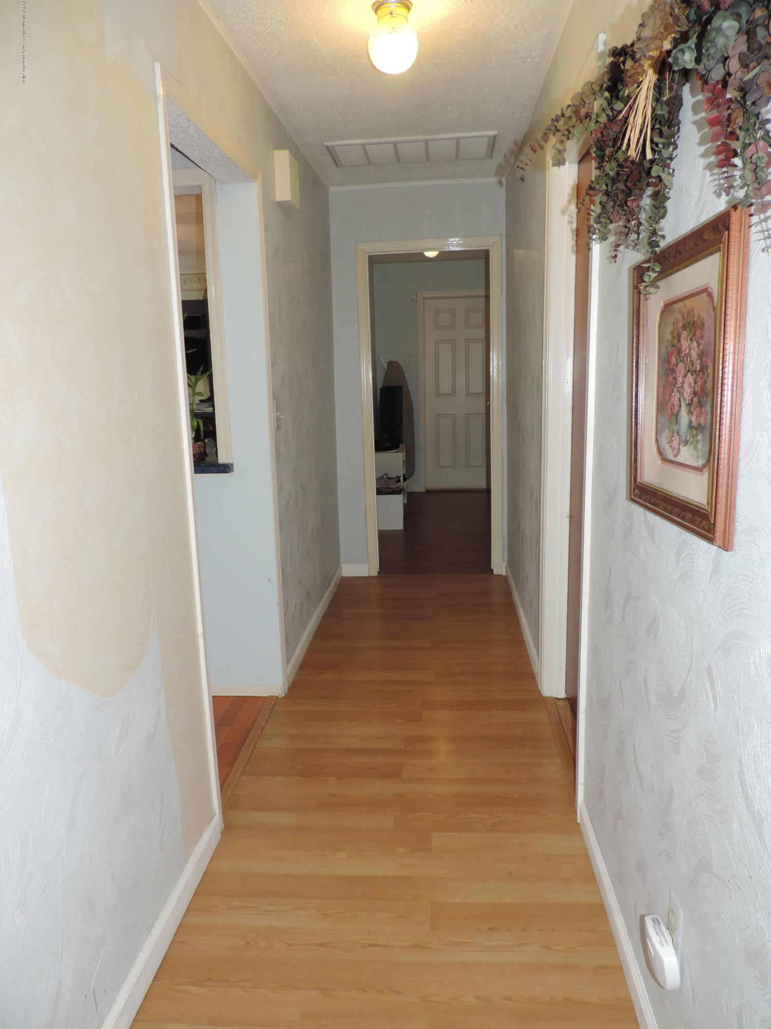 145 Breton Road Brick, NJ 08723 - Photo 14 of 33 a view of a hallway with wooden floor and closet
