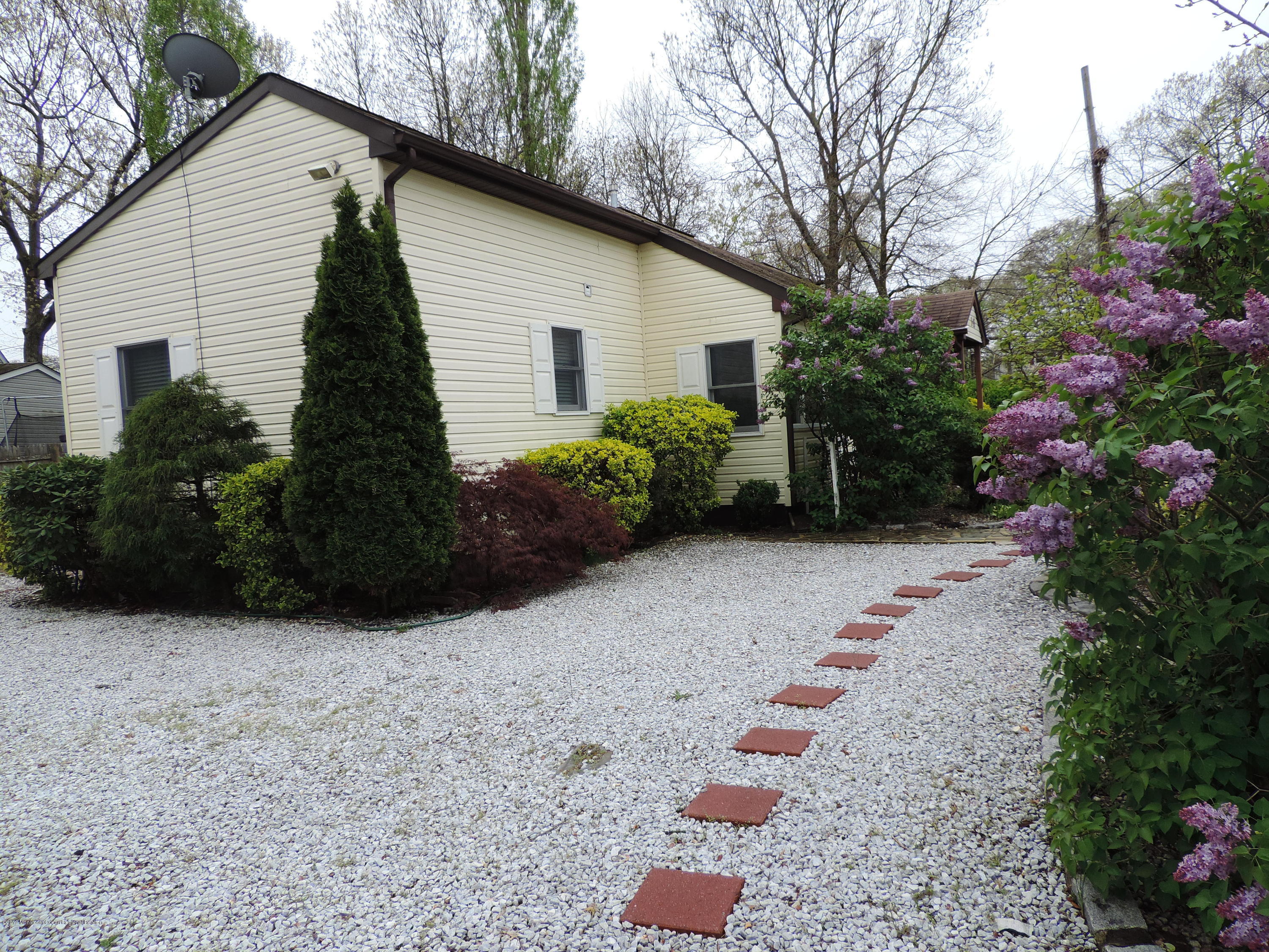 145 Breton Road Brick, NJ 08723 - Photo 3 of 33 a view of backyard with potted plants