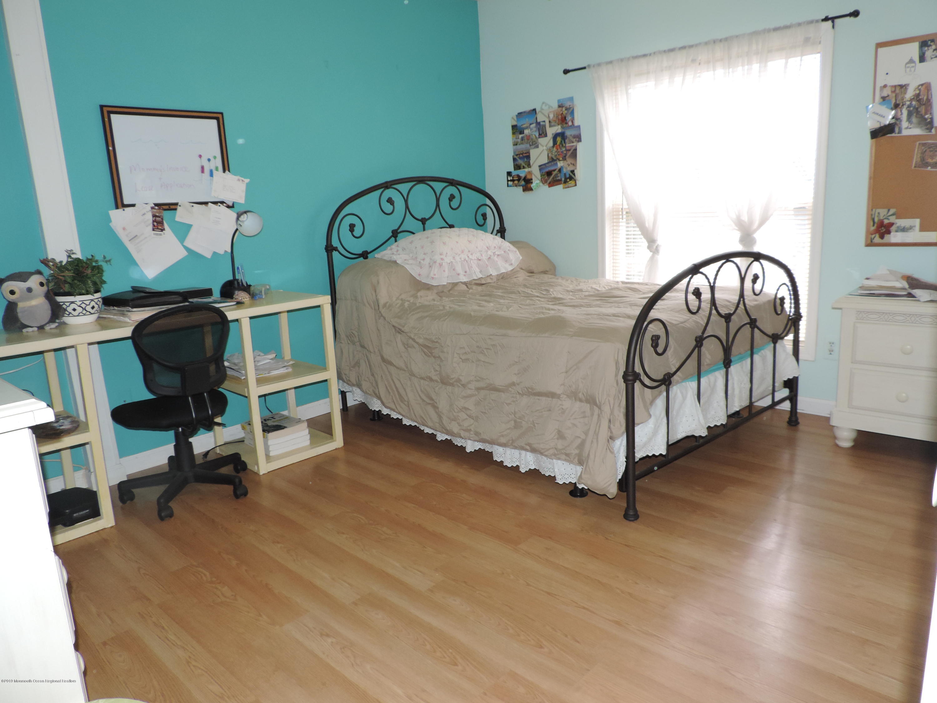 145 Breton Road Brick, NJ 08723 - Photo 22 of 33 a bedroom with furniture and a wooden floor