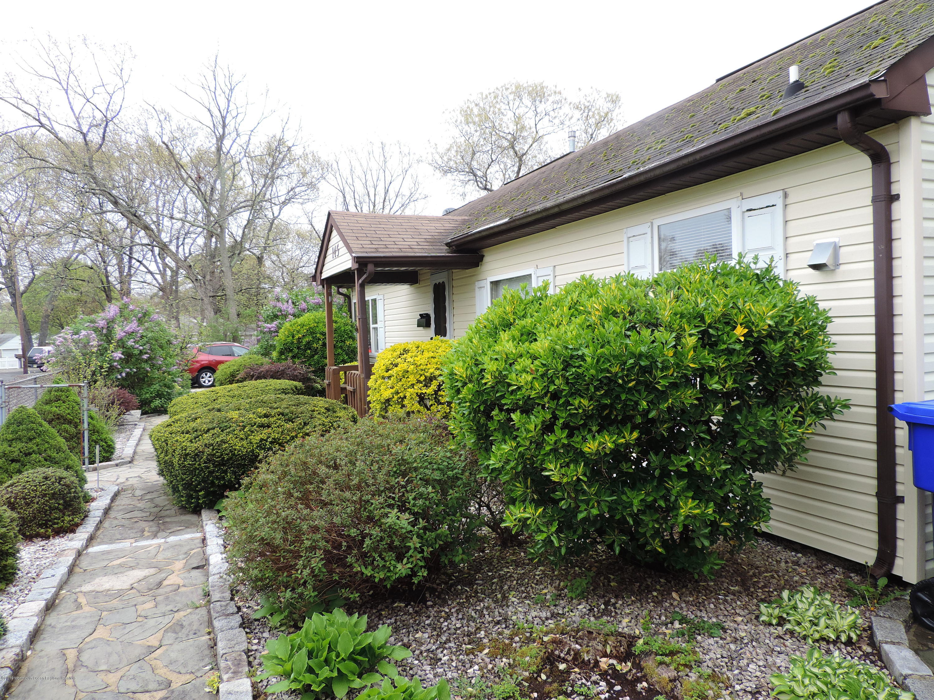 145 Breton Road Brick, NJ 08723 - Photo 5 of 33 a view of a backyard with plants