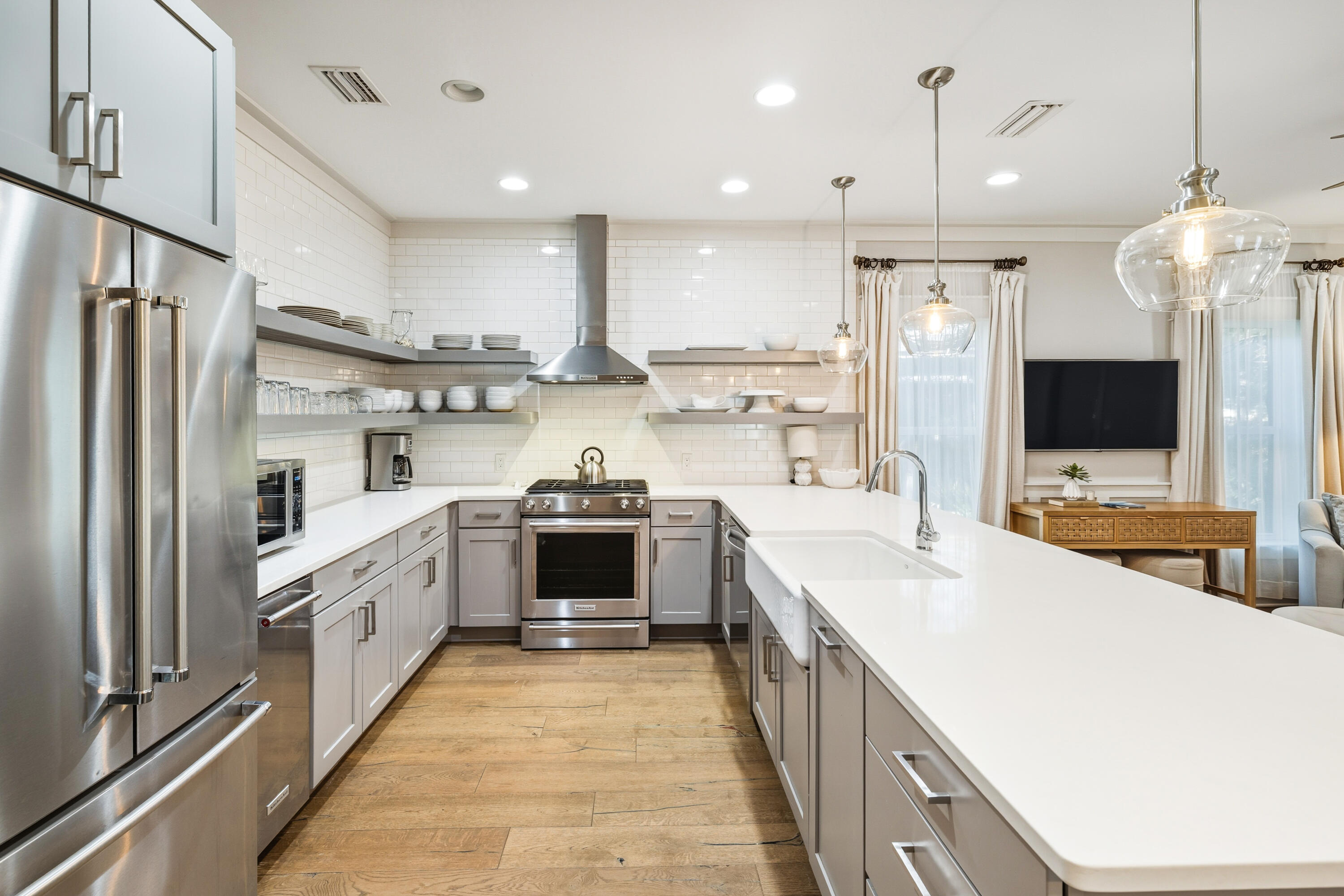 587 Patina Blvd Inlet Beach Inlet Beach, FL 32461 - Photo 16 of 52 a kitchen with a sink stainless steel appliances and white cabinets