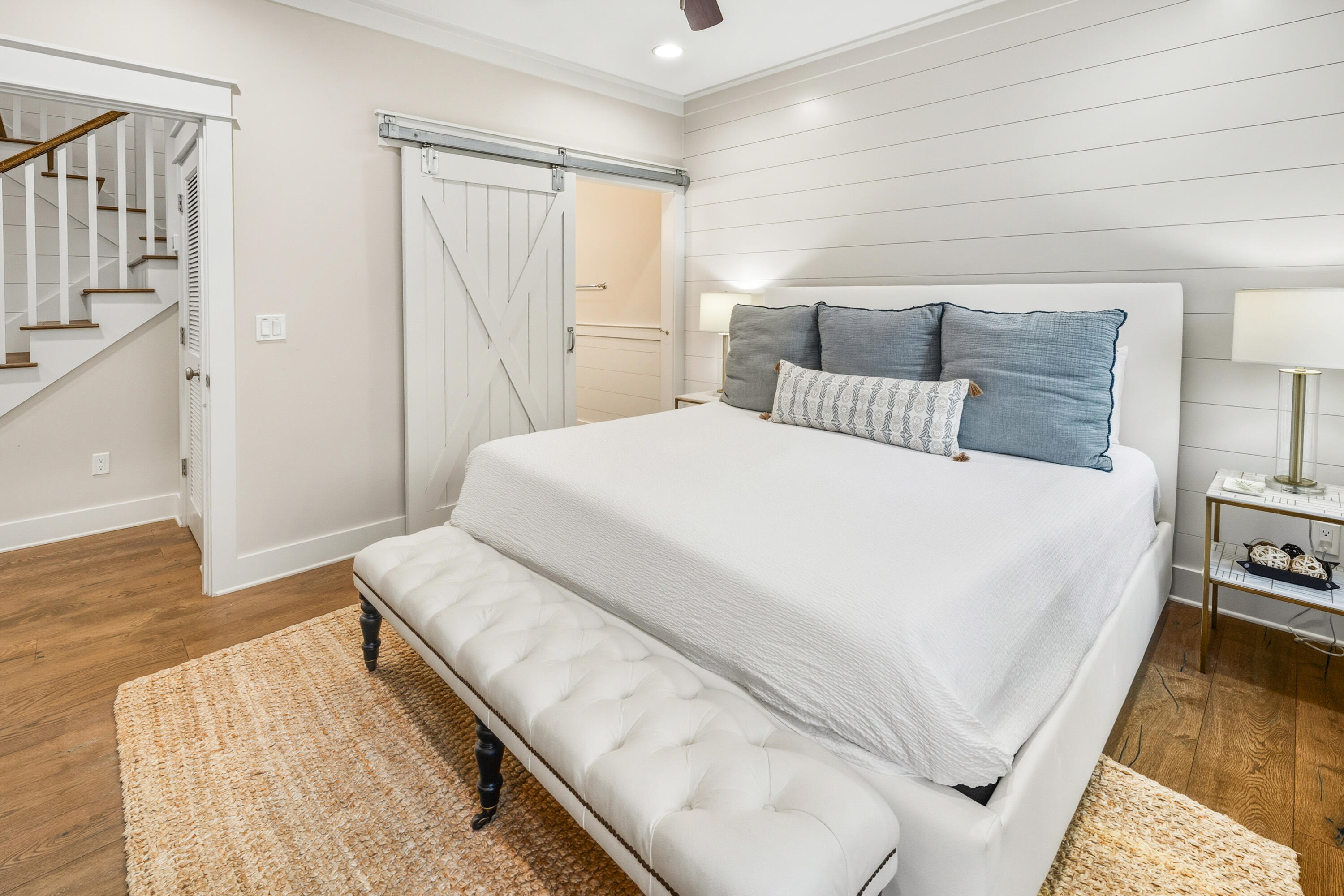 587 Patina Blvd Inlet Beach Inlet Beach, FL 32461 - Photo 18 of 52 a spacious bedroom with a bed and wooden floor