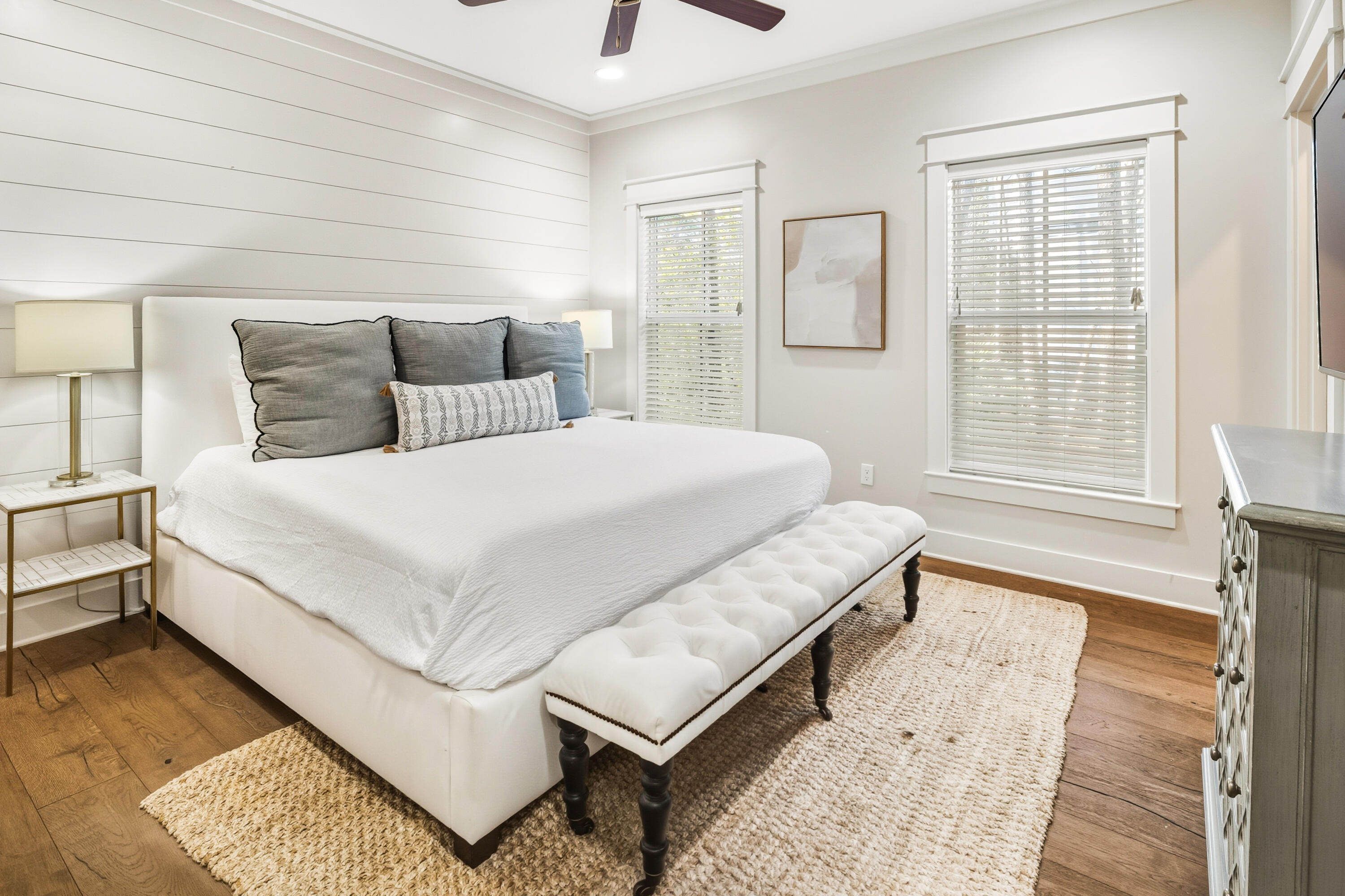 587 Patina Blvd Inlet Beach Inlet Beach, FL 32461 - Photo 21 of 52 a bedroom with a bed lamp and a large window with wooden floor