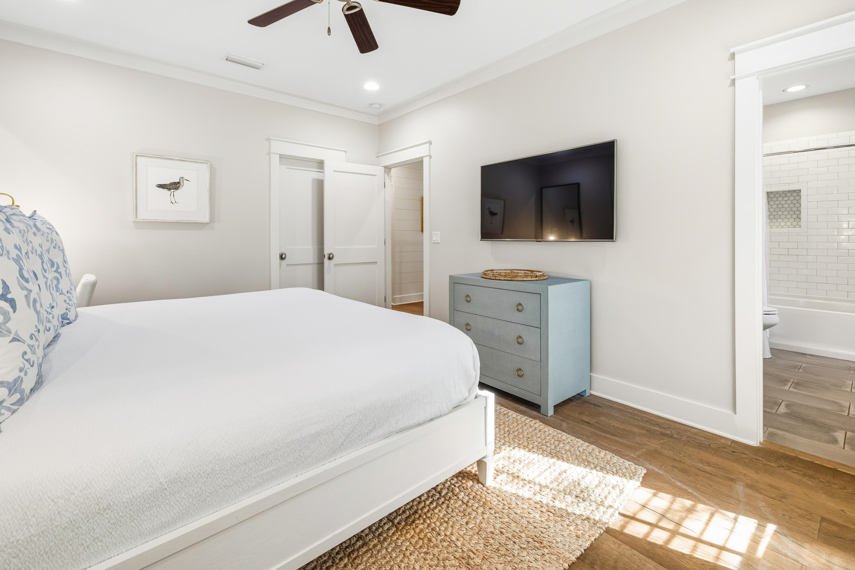 587 Patina Blvd Inlet Beach Inlet Beach, FL 32461 - Photo 26 of 52 a spacious bedroom with a bed and a flat screen tv