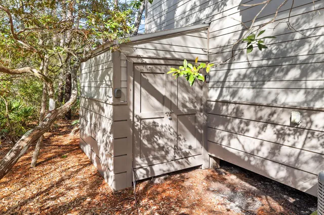 a view of a house with backyard and deck