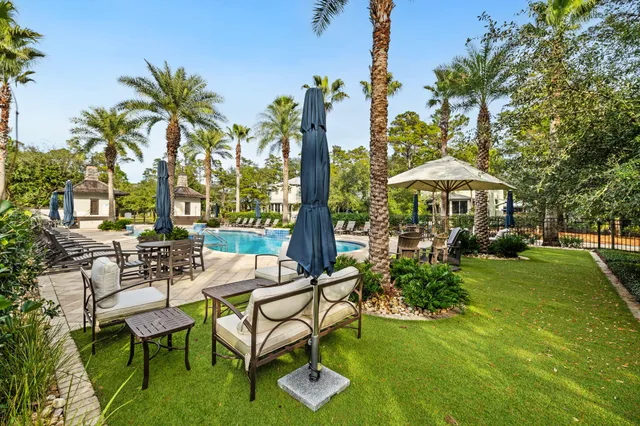 a view of a swimming pool with a yard