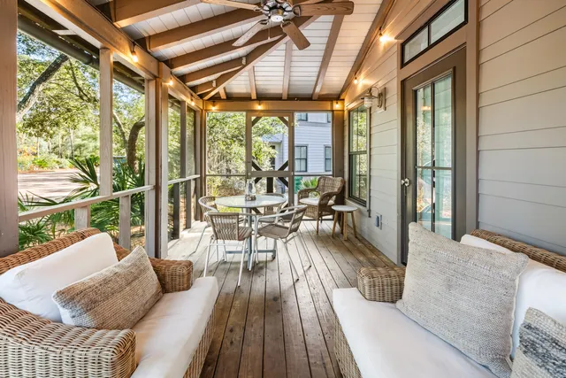 a front view of a house with outdoor seating
