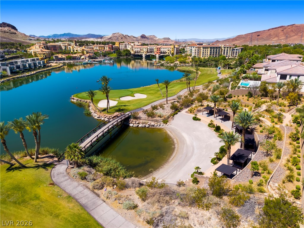 45 Garibaldi Way Henderson, NV 89011 - Photo 52 of 74 Lush green golf course and serene lake views frame this exquisite desert retreat.