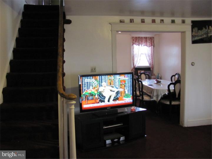 227 Copley Road Upper Darby, PA 19082 - Photo 3 of 8 a room with furniture and window