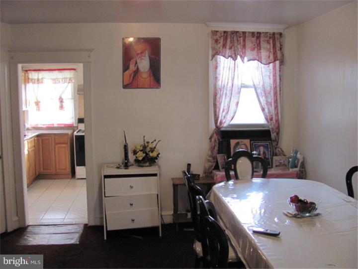227 Copley Road Upper Darby, PA 19082 - Photo 4 of 8 a room with a window and a table