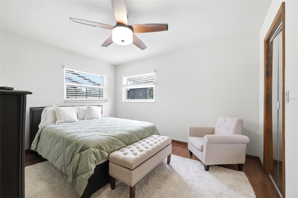 5227 Suwannee Road Weeki Wachee, FL 34607 - Photo 31 of 62 a bedroom with a bed and a couch