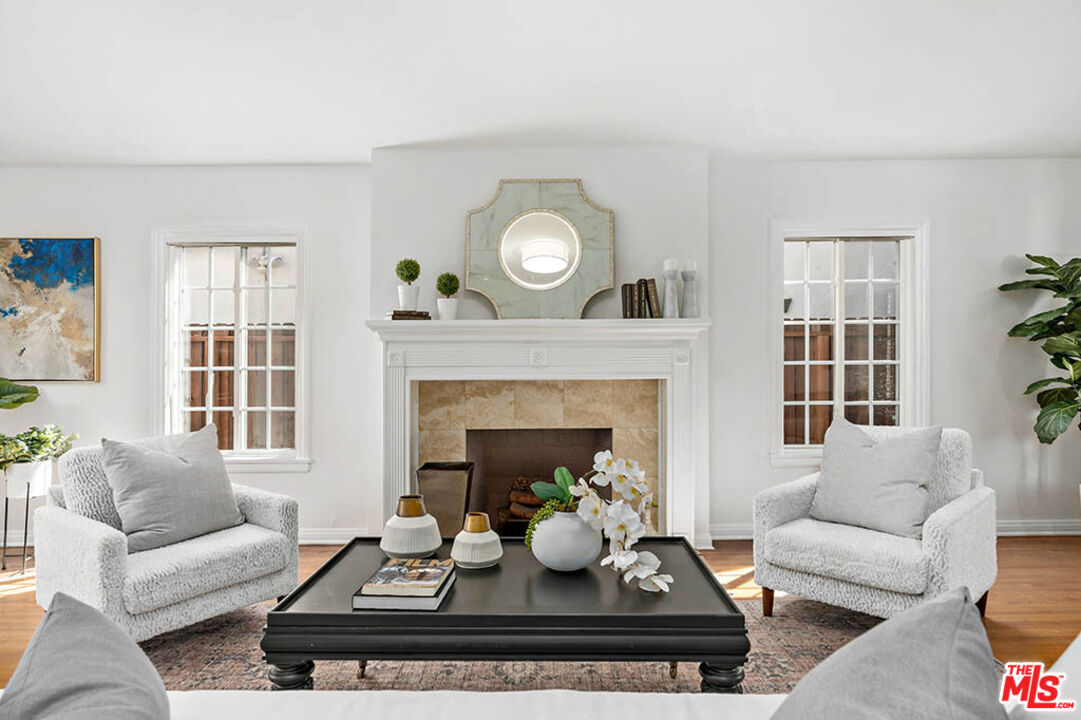 620 North Cherokee Avenue Los Angeles, CA 90004 - Photo 14 of 64 a living room with furniture and a fireplace