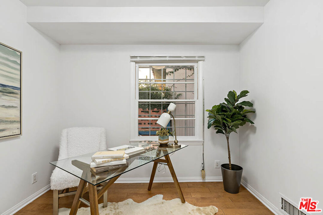620 North Cherokee Avenue Los Angeles, CA 90004 - Photo 31 of 64 a workspace room with furniture and a potted plant