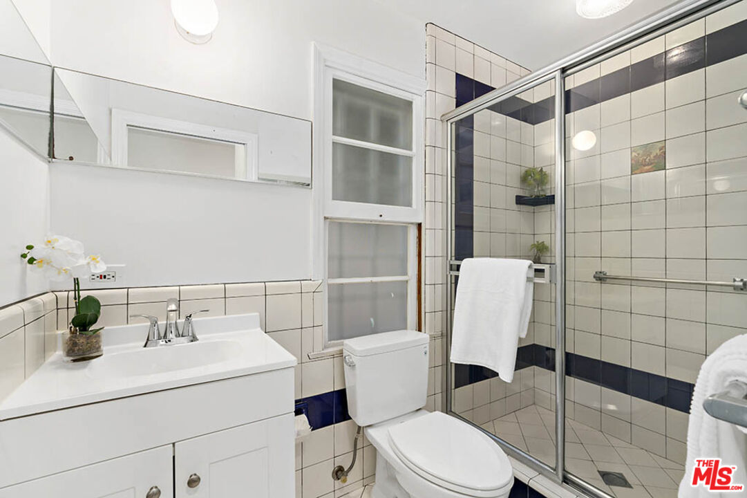 620 North Cherokee Avenue Los Angeles, CA 90004 - Photo 33 of 64 a bathroom with a sink toilet and shower