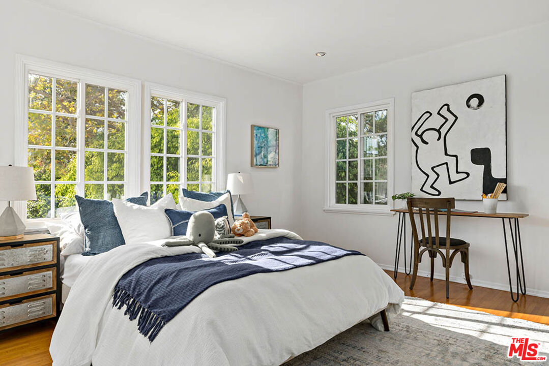 620 North Cherokee Avenue Los Angeles, CA 90004 - Photo 42 of 64 a bedroom with a bed and a table