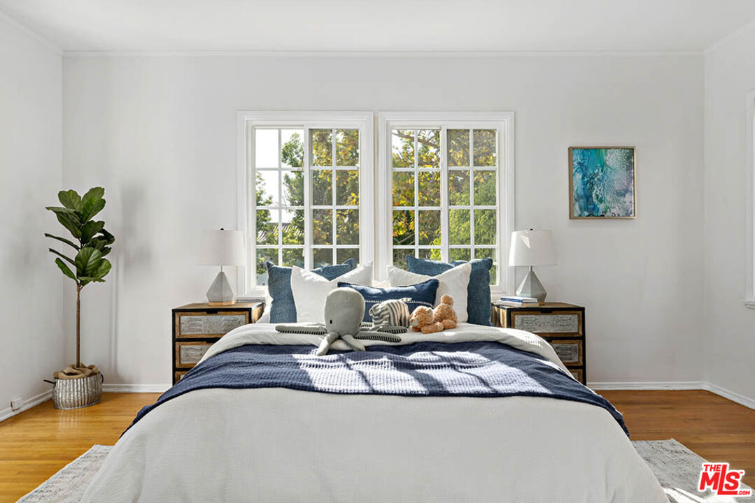 620 North Cherokee Avenue Los Angeles, CA 90004 - Photo 44 of 64 a bedroom with a bed and a window