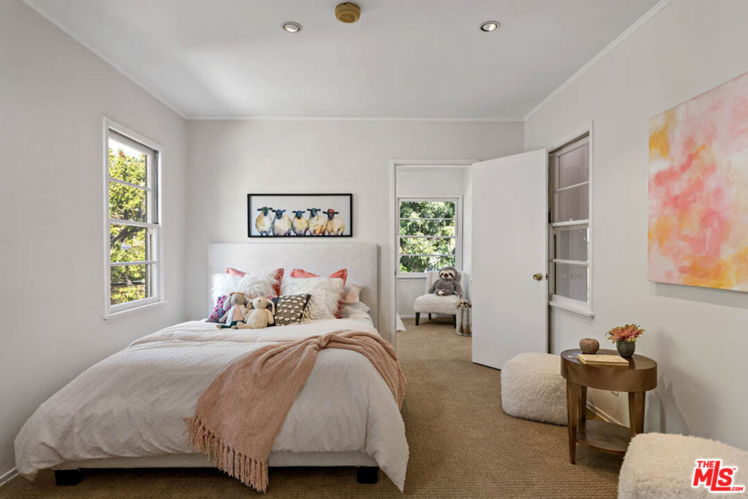 620 North Cherokee Avenue Los Angeles, CA 90004 - Photo 48 of 64 a bedroom with a bed and a couch