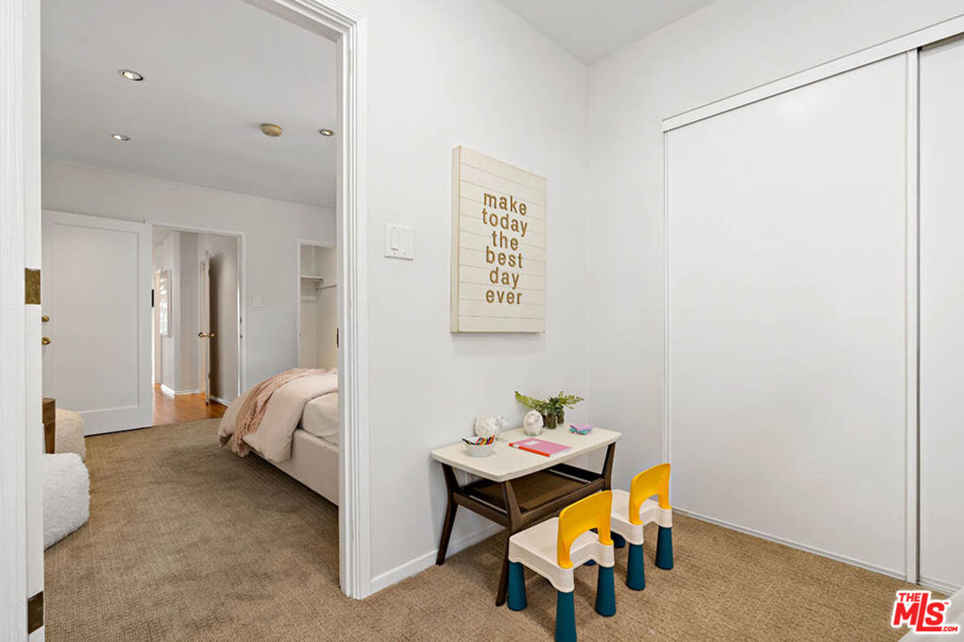 620 North Cherokee Avenue Los Angeles, CA 90004 - Photo 51 of 64 a bedroom with a bed and a table