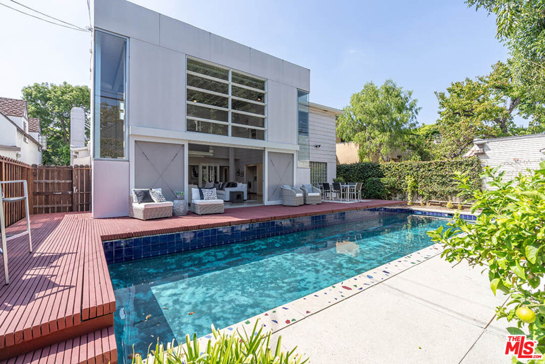 620 North Cherokee Avenue Los Angeles, CA 90004 - Photo 53 of 64 a view of swimming pool with a garden and plants