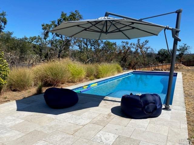 5424 Spring Rock Court Santa Rosa, CA 95404 - Photo 1 of 1 a view of a table and chairs under an umbrella