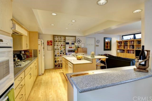 449 34th Street Manhattan Beach, CA 90266 - Photo 2 of 2 a living room with stainless steel appliances granite countertop a sink and a counter space