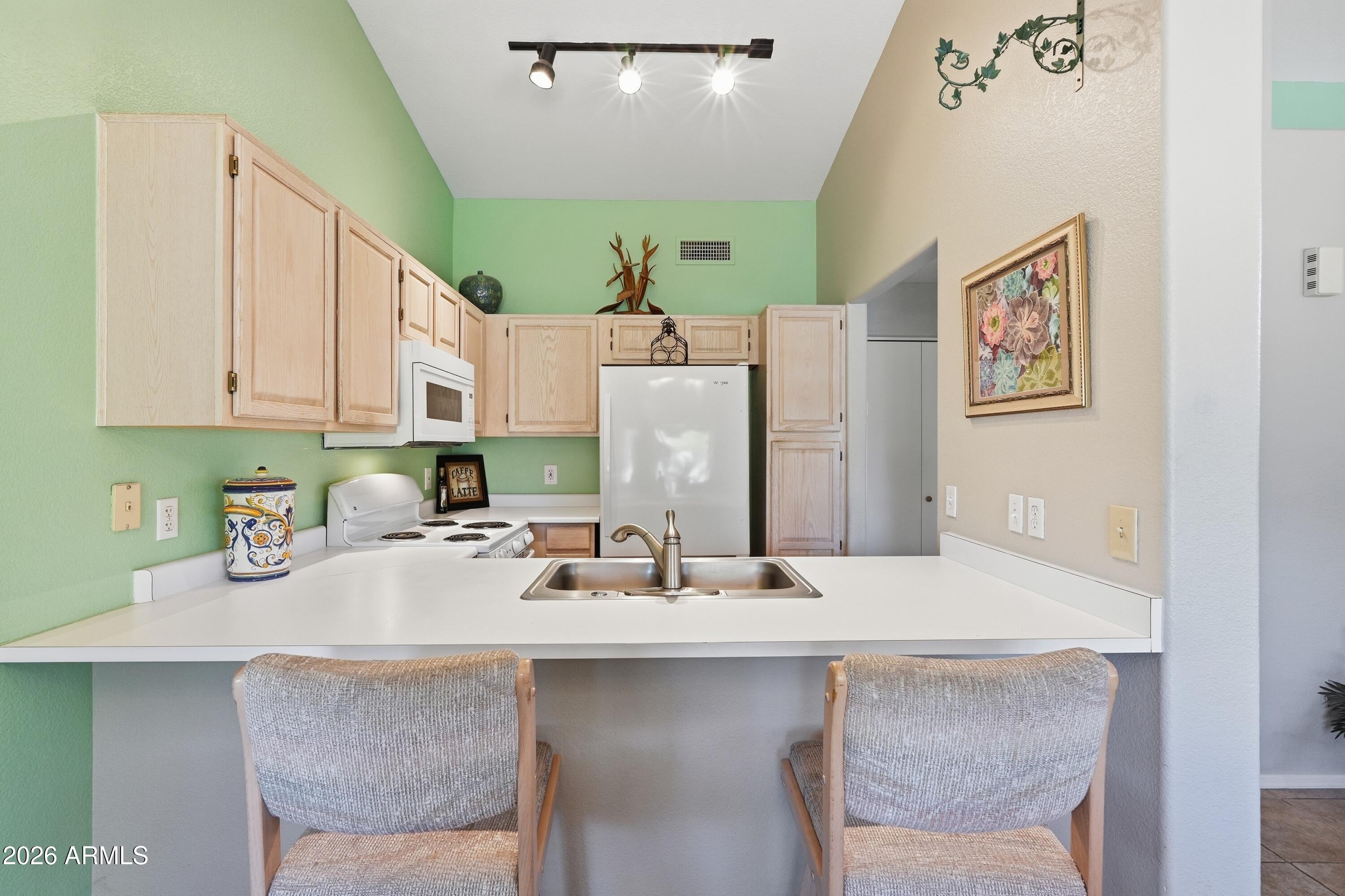 14300 West Bell Road, Unit 288 Surprise, AZ 85374 - Photo 9 of 30 13_Kitchen_Breakfast Bar