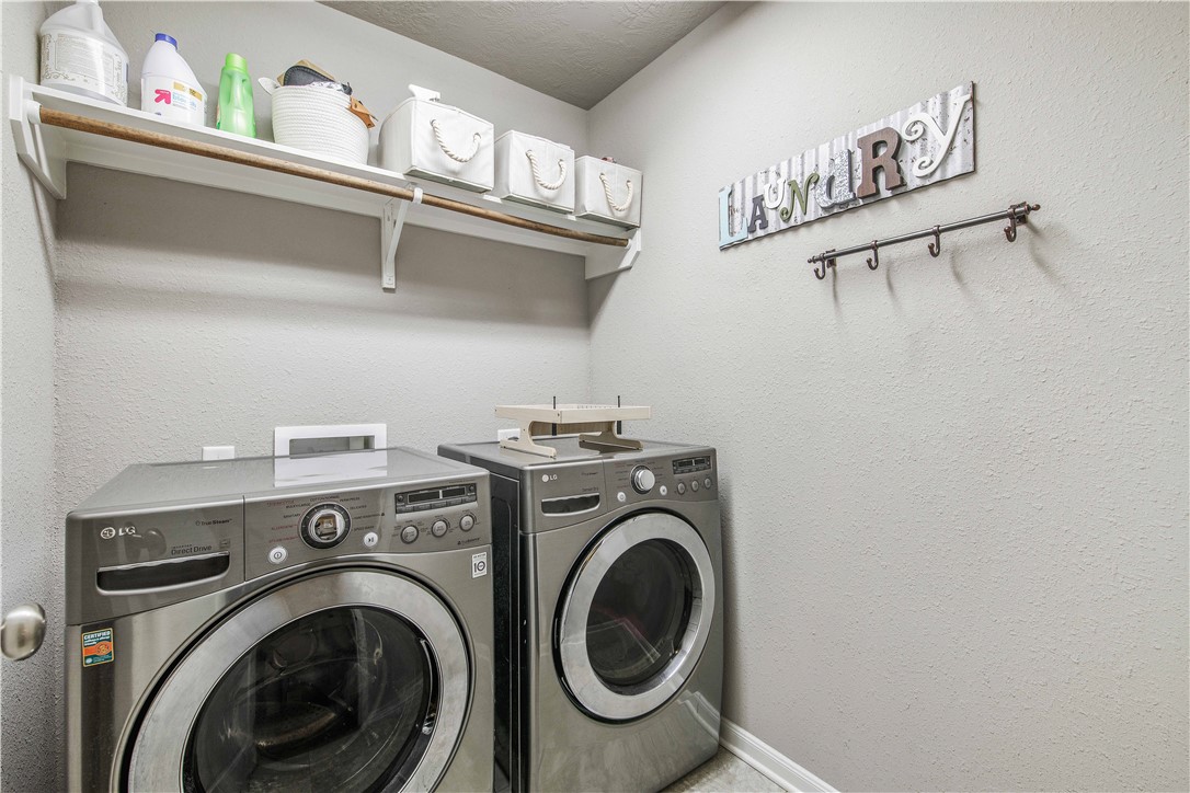 3014 Positano Loop Bryan, TX 77808 - Photo 19 of 23 a utility room with dryer and washer