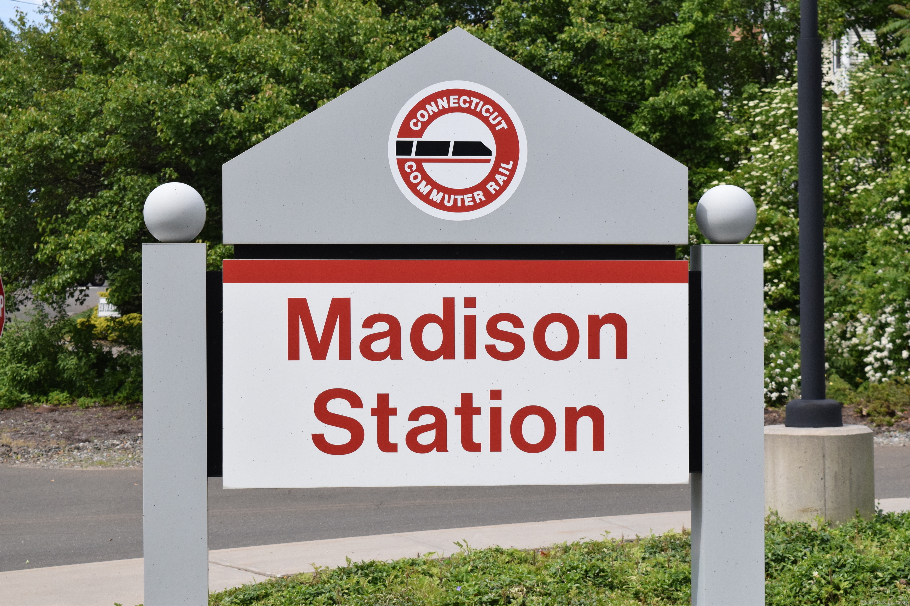 37 Dudley Lane, Unit 6 Madison, CT 06443 - Photo 12 of 12 a sign broad on the side of a road