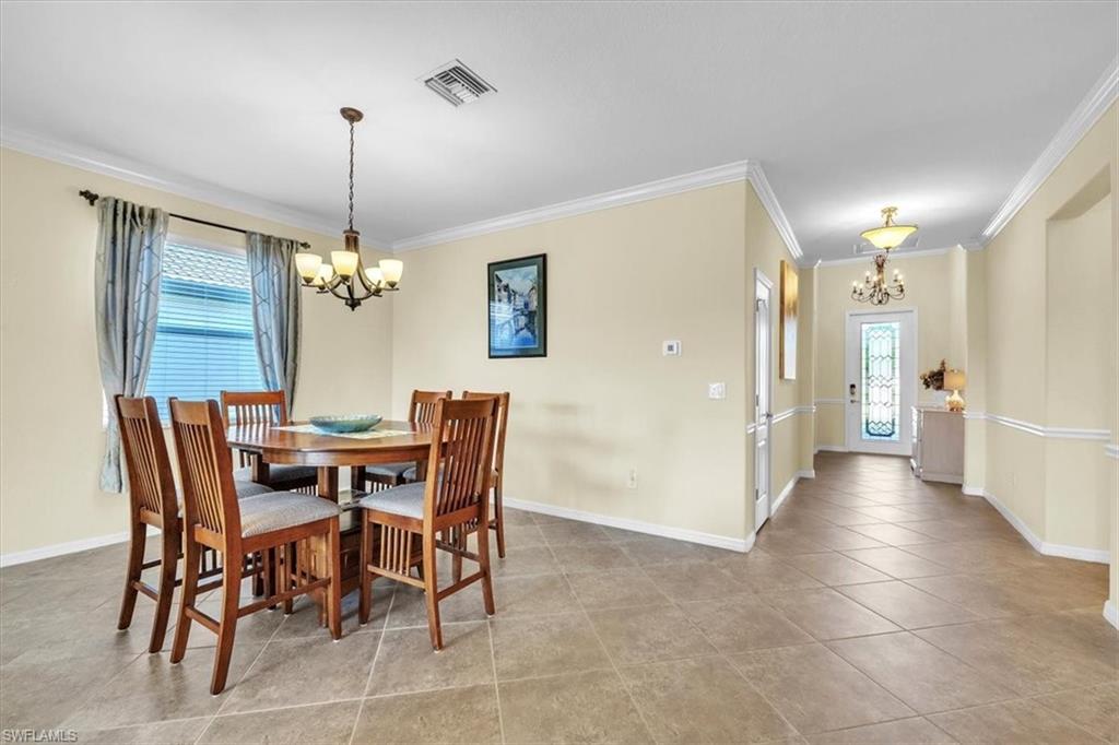 3112 Walnut Grove Lane Alva, FL 33920 - Photo 17 of 50 a view of a dining room with furniture and chandelier