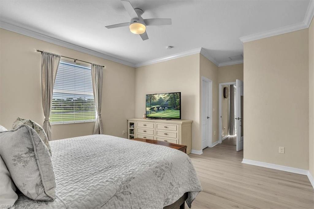 3112 Walnut Grove Lane Alva, FL 33920 - Photo 19 of 50 a bedroom with a bed and wooden floor