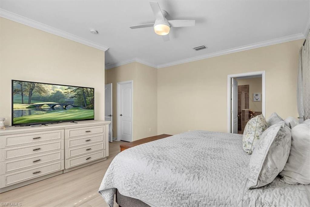 3112 Walnut Grove Lane Alva, FL 33920 - Photo 20 of 50 a bedroom with a bed and a flat screen tv