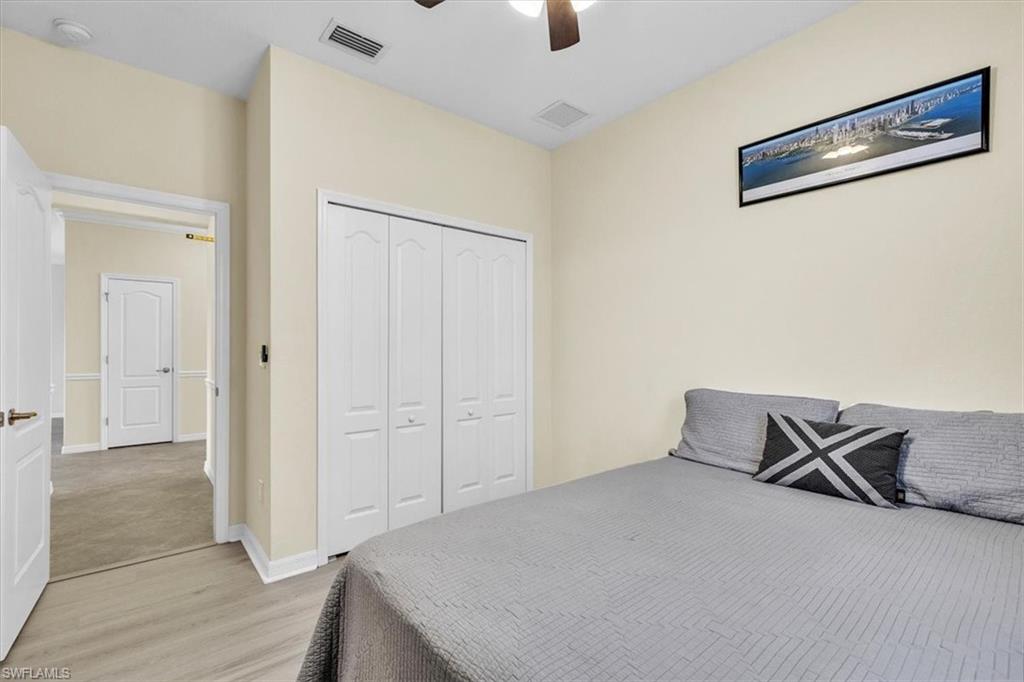 3112 Walnut Grove Lane Alva, FL 33920 - Photo 25 of 50 an empty room with wooden floor closet and windows