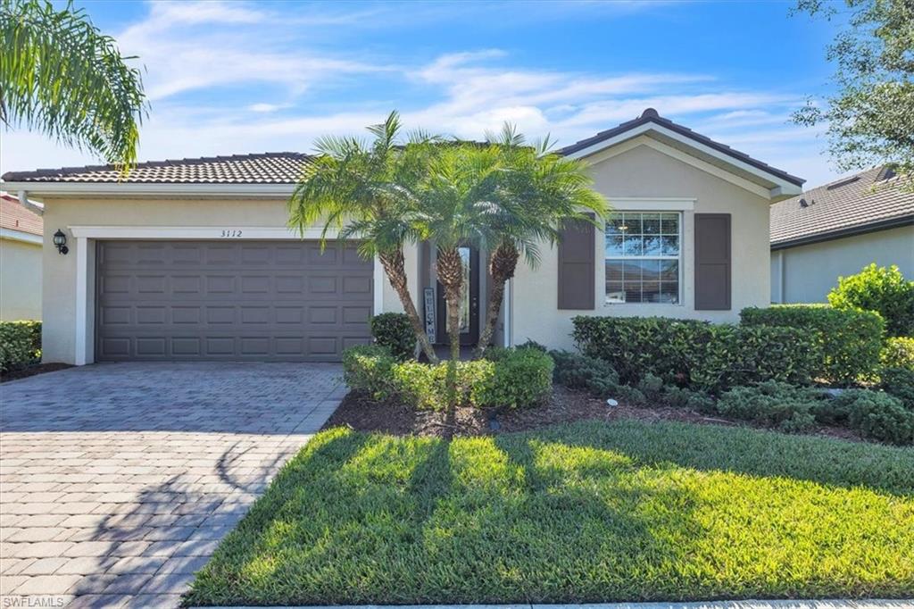 3112 Walnut Grove Lane Alva, FL 33920 - Photo 3 of 50 a front view of a house with a garden