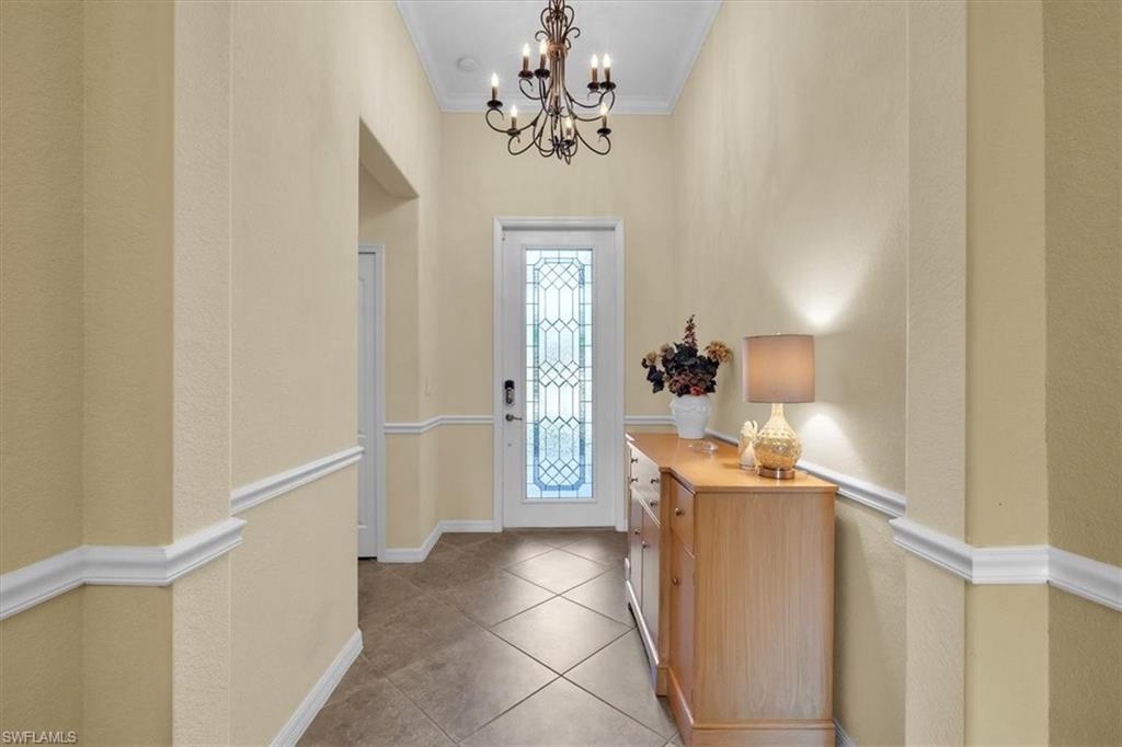3112 Walnut Grove Lane Alva, FL 33920 - Photo 5 of 50 a view of a hallway to a livingroom with furniture stairs and front door