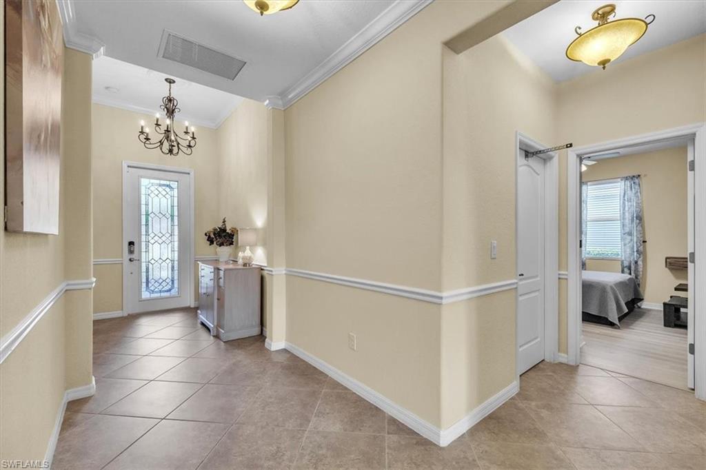 3112 Walnut Grove Lane Alva, FL 33920 - Photo 6 of 50 a view of a hallway with closet and a chandelier fan