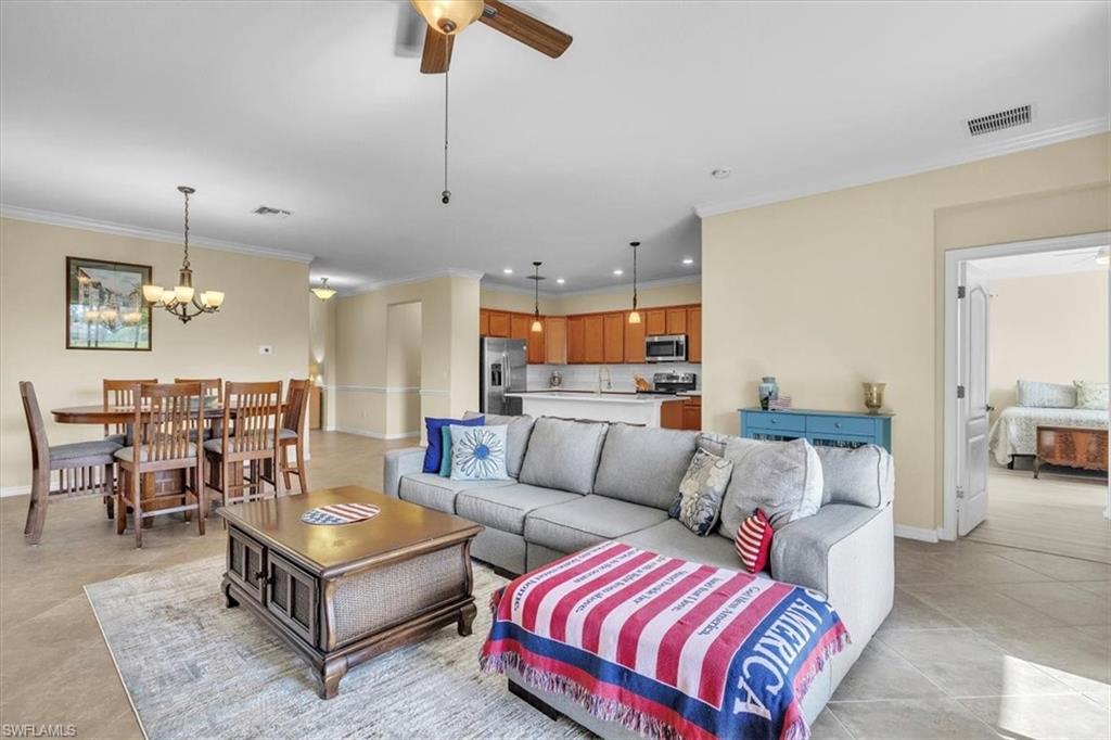 3112 Walnut Grove Lane Alva, FL 33920 - Photo 9 of 50 a living room with furniture and kitchen view