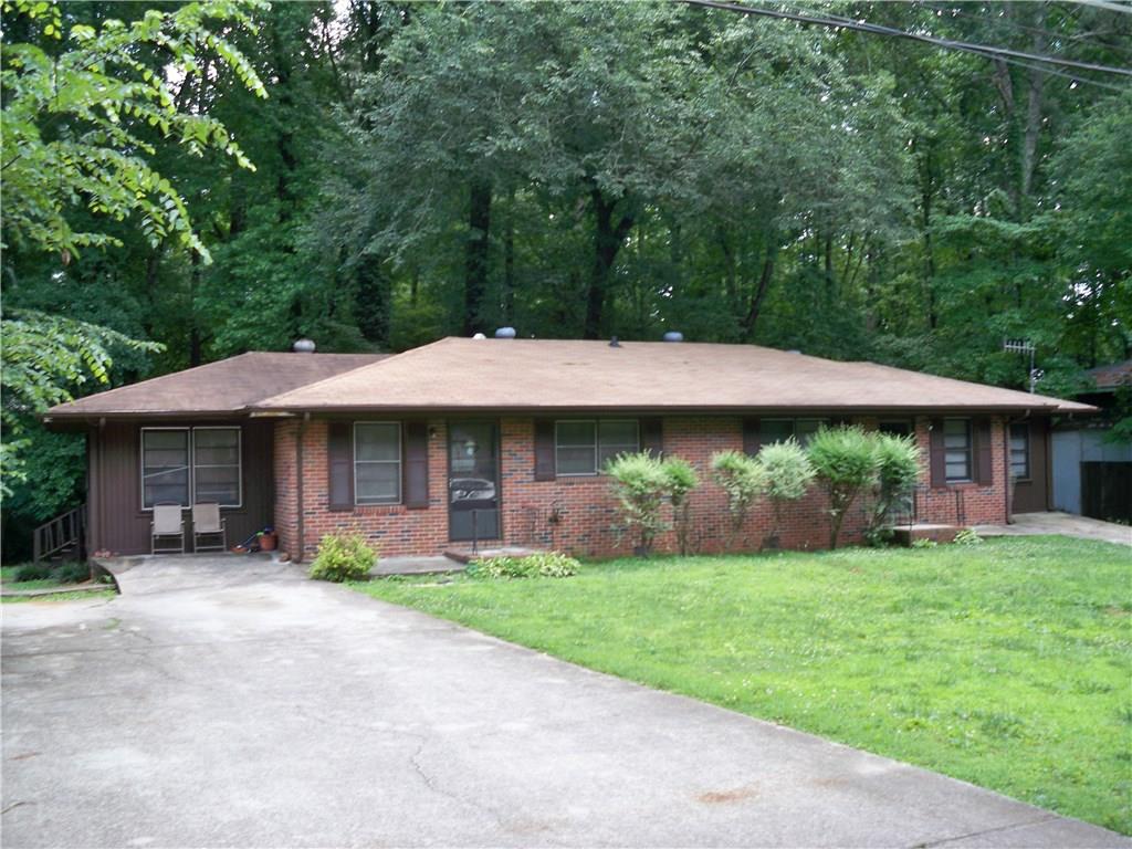 5115 Jones Road Austell, GA 30106 - Photo 1 of 1 a front view of a house with garden