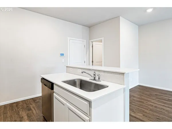 a kitchen with a sink and cabinets